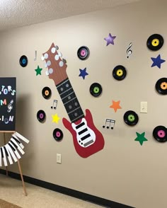 a room with guitars and musical notes on the wall