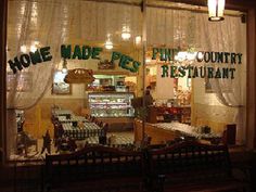 a store front window with the words home made pies written in green on it