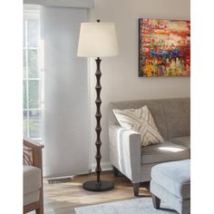 a living room scene with focus on the floor lamp