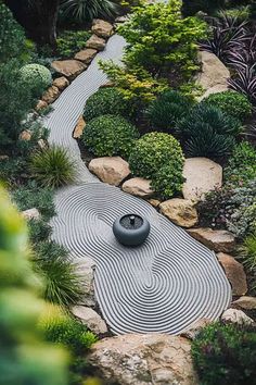 A small Mediterranean-inspired garden with zen design elements, featuring a gravel pathway surrounded by lush green shrubs and rocks. Spanish Garden Ideas, Gravel Garden Ideas, Garden Ideas Australia, Garden Ideas For Small Spaces, Garden Transformation, Spanish Garden