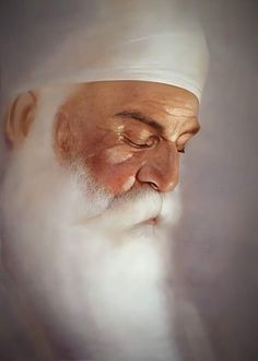 an old man with a white beard wearing a turban and looking at something