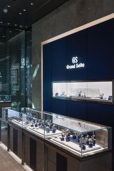 the inside of a jewelry store with glass displays