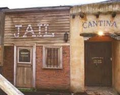 an old building with a sign that says jail app store out to lunch