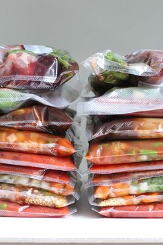 several bags of food are stacked on top of each other with the words 20 crockpot freeze meals for two people