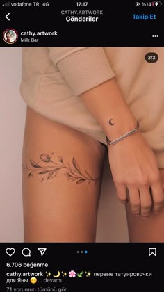 a woman's arm with a tattoo on the side of her leg and an arrow