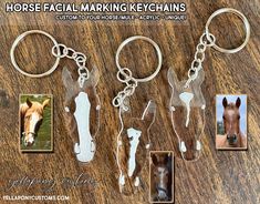 four keychains with pictures of horses on them and the words, horse facial marking keys chains