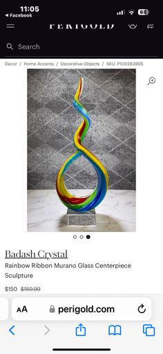 an image of a glass sculpture on the app store's iphone screen, which is displaying it