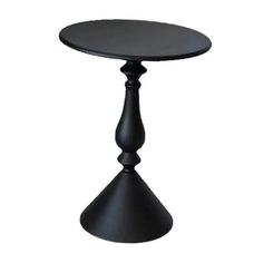 a small black table with a round top and two legs on one side, in front of a white background