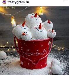 a bucket filled with snowballs sitting on top of a table