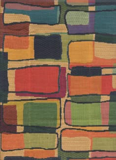 a multicolored rug with squares on it