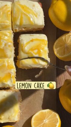 lemon curd cake on a cutting board with sliced lemons