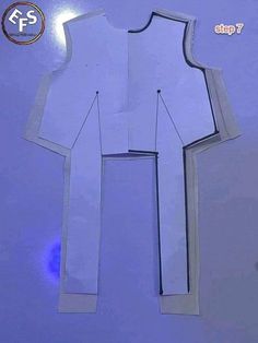 paper cut out of a man's shirt and tie