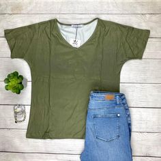 Get Ready To Fall In Love With The Fit And Fabric Of This Olive V-Neck Top. It Has A V Neck Line, Longer Short Sleeves, And A Slight Dolman Look. The Body Is A Relaxed Fit With Still Bringing That Feminine Look To It. This Will Sure To Be Your Newest Grab And Go Favorite! Fit: Runs True To Size With High Stretch. Material Is 95% Polyester And 5% Spandex Measurements: Chest 18.5” Body Length 25.6” Sleeve Length 10.6” Search Purposes Only: Casual Office Top Work Top Comfortable Trendy Fall Tops Wi Spring V-neck Stretch T-shirt, Casual Solid Color V-neck Top For Summer, Casual Solid Color V-neck Top For Spring, Spring Everyday V-neck Top, Casual V-neck Top For Spring, Casual V-neck Tank Top For Spring, Casual Stretch V-neck Top For Summer, Everyday Stretch V-neck Top, Stretch V-neck Top For Everyday