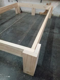 the bed frame is made up and ready to be built into someone's house