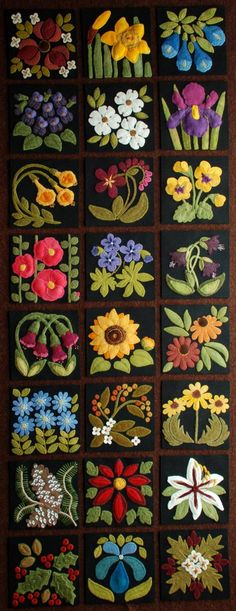 a quilt with flowers and leaves on the front, along with other appliques