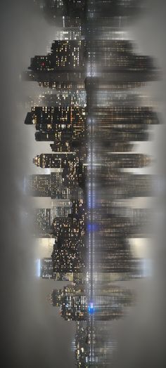 an image of a city skyline in the foggy night with skyscrapers lit up