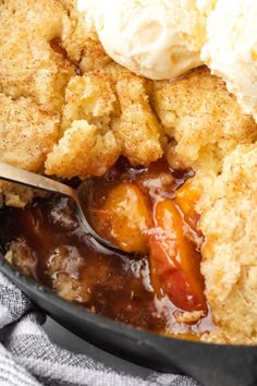 a skillet filled with apple cobbler and ice cream