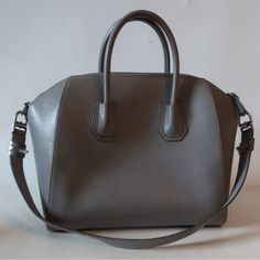 Silver-Toned Givenchy Hardware Goatskin 1interior Slip Pocket 1interior Slip Media Pocket 11 Regular Zip Interior Pocket Top Width Is 16” Base Width Is 13.1” Depth Is 7.5” Height Is 11.2” Strap Drop Is 11.2” Handle Drop Is 3.3” Pic With Model Is To Show Bag Size Only. Wear On Top Handles, Bag Edges, And Some Of The Piping. Scratch Between Back Handle Notches. Minor Scratch Near Front Bag Edge. Lining Has Marks That May Clean Out. Otherwise In Amazing Condition. Interior Is Black. A Gorgeous Pre- High-end Silver Rectangular Shoulder Bag, Silver Handheld Satchel For Daily Use, Luxury Silver Shoulder Bag For Shopping, Silver Handheld Satchel For Shopping, Luxury Handheld Satchel With Silver-tone Hardware, Handheld Silver Satchel For Shopping, High-end Satchel Tote With Silver-tone Hardware, High-end Tote Satchel With Silver-tone Hardware, Designer Silver Rectangular Satchel