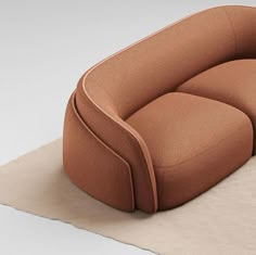 a brown chair sitting on top of a rug