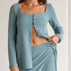 Sabo Daria Top Is Made From A Ribbed Fabric In A Dusty Blue Hue. It Is A Relaxed Style Featuring Full Length Sleeves, Square Neckline, Split At Centre Front And Covered Buttons At Bust. Brand New With Tags In Bag! *Outer 97% Polyester 3% Spandex | Lining 95% Polyester 5% Spandex *Length 26" | Across Waist 18" *Measurements Taken From Size S *Fully Lined (Excluding Sleeves) | Not Sheer *Model Wears Size S (Size Guide In Pics) ***Matching Skirt Available Upon Request- Size Medium Brand New As Well Pink Satin Top, Skirt Tops, Dusty Blue Color, Boho Crop Tops, Skirt Crop, Bodice Top, Cropped Long Sleeve Top, White Caps, Sabo Skirt