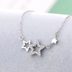 Make a stellar impression with our Shooting Stars Necklace! This fashionable piece features a magnificent star pattern crafted with durable zinc alloy metal. Show off your star power with this stunning accessory! DETAILSPattern Type: StarMaterial: MetalMetals Type: Zinc alloy Elegant Y2k, Shooting Star Necklace, Pentagram Design, Stars Necklace, Star Necklace Silver, Diy Bracelets Patterns, Necklace Elegant, Jewelry Accessories Ideas, Classy Jewelry