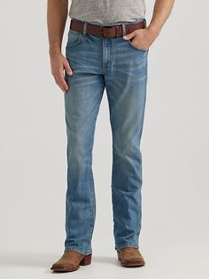 NOTHING BEATS AN ORIGINAL, BUT THIS MIGHT Since 1947, Wrangler® jeans have been a cowboy-approved wardrobe staple. Inspired by our Western heritage, these Wrangler® Retro® jeans combine our most iconic features with contemporary fits and washes. This updated classic features the same worn leather patch with our rope logo, 'W' stitching on the back pockets, and five-pocket styling. These men's slim bootcut jeans feature a streamlined silhouette through the seat, thigh, and knee, but the leg widen Fitted Jeans With Five Pockets For Ranch, Fitted Rugged Jeans In Medium Wash, Fitted Dark Wash Jeans For Ranch, Medium Wash Denim Jeans For Ranch, Straight Leg Denim Jeans For Ranch, Classic Medium Wash Jeans For Rodeo, Fitted Straight Leg Jeans For Ranch, Fitted Straight Leg Jeans For Rodeo, Fitted Western Jeans For Rodeo