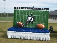 a football field with two balls on it and a dog jumping over the top in the air