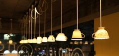 the lights are hanging from the ceiling in the restaurant or bar, and there is no image here to provide a caption for