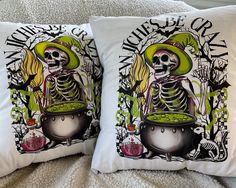 two pillows that have skeletons on them