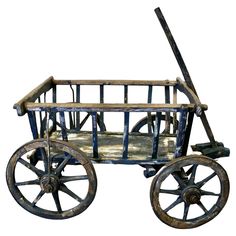 an old fashioned wooden wagon with wheels