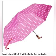 an open pink polka dot umbrella on a white background with the words masac mezrink & white polka dot umbrella