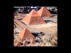 three pyramids are shown in the desert