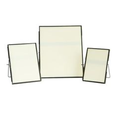 three frames are shown with white paper on the bottom and one has a black frame