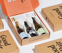 six bottles of wine in a box with the words good food written on each one