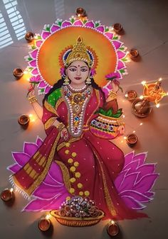 an image of a woman sitting on top of a flower with candles around her and lights in the background