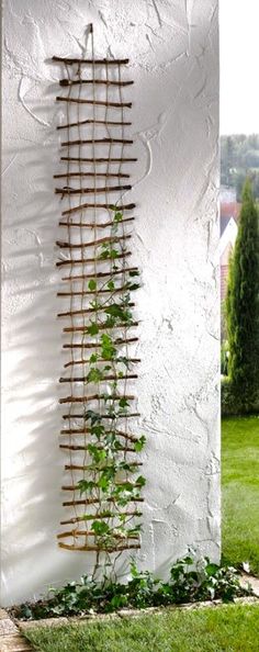 an artistic sculpture made out of sticks and plants