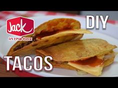 two tacos on a plate with the words jack in the box written above it