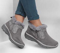 Stay comfy all season long with Skechers Relaxed Fit Easy Going - Cozy Inn. This zip bootie features a treated 3M Scotchgard suede upper with a sweater-knit trim, faux-fur lining, and a cushioned Skechers Air-Cooled Memory Foam insole. | Skechers Women's Relaxed Fit: Easy Going - Cozy Inn Boots | Medium Width | Skechers Air-Cooled Memory Foam cushioned comfort insole | Relaxed Fit for a roomy comfort fit at toe and forefoot | Treated with 3M Scotchgard to resist water and stains | Suede upper wi Skechers Boots, Cozy Inn, Skechers Relaxed Fit, Comfy Boot, Lace Up Wedges, Snow Boots Women, Skechers Women, Easy Going, Grey Fashion