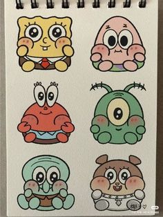 an image of cartoon character stickers on a notepad with marker pens in it