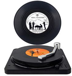 an old record player with vinyl coasters on it