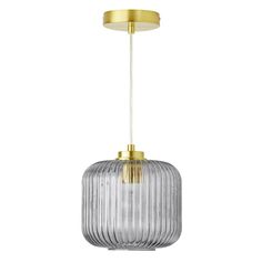 a glass and brass pendant light hanging from the ceiling