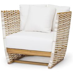 a wicker chair with white pillows on the seat and back cushion is made out of wood