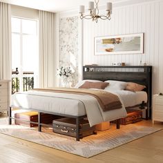 a bedroom with a bed, dresser and chest of drawers in the middle of it