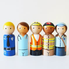 a group of wooden toy soldiers standing next to each other