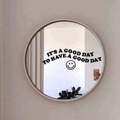 a round mirror that says it's a good day to have a good day