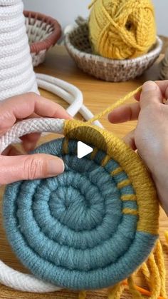 someone is crocheting the yarn on top of an object that looks like a spiral