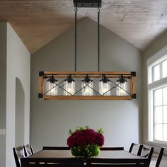 a dining room table with flowers on it