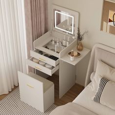 a bedroom with a bed, dressing table and mirror on the wall next to it