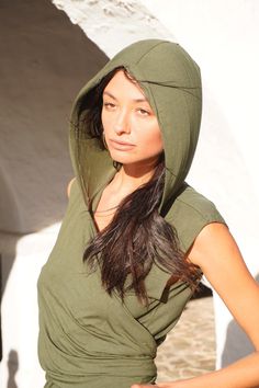 Versatile Boho Vest, Hooded Vest Top, Festival Wrap Vest wear sizes S to L- Model 182cm size  L Explore your unique style with this striking green vest - a fusion of asymmetry and versatility. Featuring an edgy asymmetrical design and a stylish hood, this vest is perfect for those who embrace alternative looks. Wear it in different ways to express your individuality, making it an ideal choice for festivals and beyond. Elevate your wardrobe with this standout piece that seamlessly blends fashion Festival Vest, Wrap Vest, Boho Vest, Handmade Leather Bracelets, Green Vest, Bamboo Plants, Hooded Vest, Vest Outfits, Asymmetrical Design