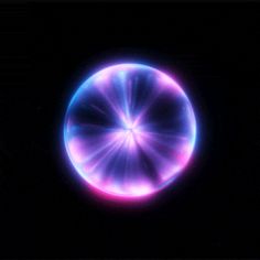 an image of a circular object in the dark with blue and pink lights on it